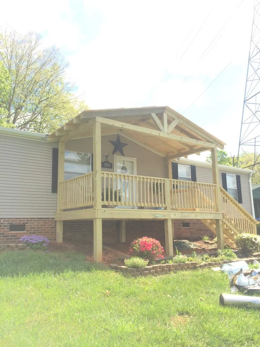 New gabled porch roof and deck railing added to a ranch home in Sedro Woolley
